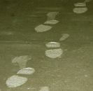 There isn't a better way to tell when its time to start the finishing operation than to step on the slab and see how deep footprints are. They should be 1/8 to ¼ inch.