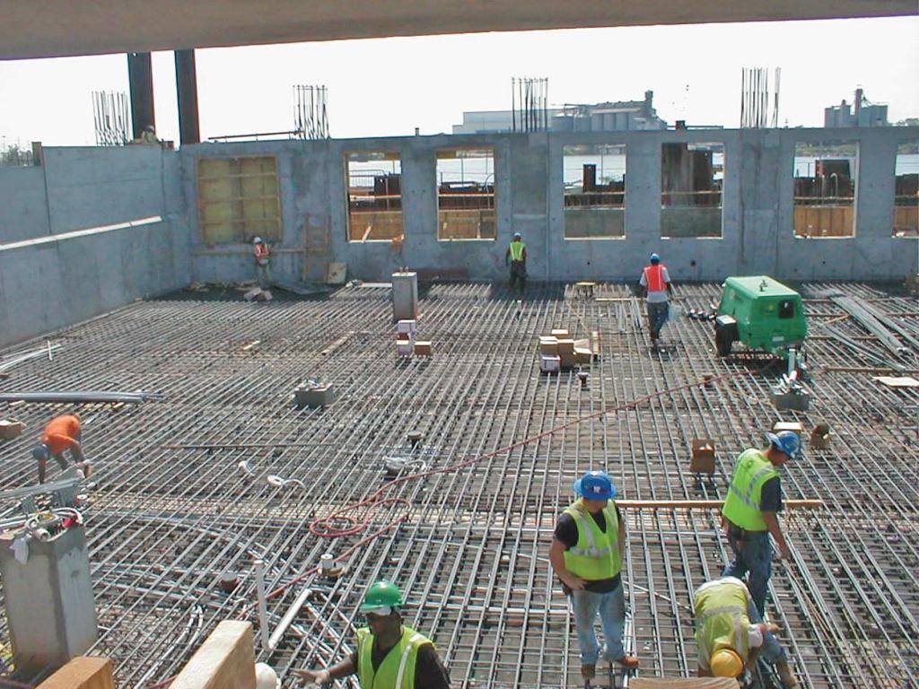 Continuous rebar in this 110x200-ft. 7- to 11-in. slab on grade will provide restraint against concrete expansion allowing the contractor to place a monolithic slab without any contraction joints, seams, or shrinkage cracks. The resulting slab will have greater durability and save the owner slab and joint maintenance cost.