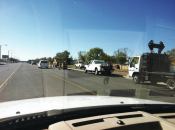 Led by maintenance supervisor Greg Abeyta, county road crews make 15-minute patches in preparation for a slurry seal and restripe that will add bike lanes to a recently inherited former state highway.