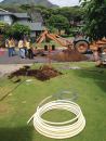 Trenchless rehabilitation with new CPVC composite service line being pulled in at the water meter in Maui, Hawaii.