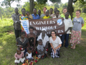 Tufts University: Travel Team with members of the Water Board and children of the community.