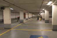 Contractors install protective coating on a parking deck floor slab in accordance with ACI 562, which was developed specifically for concrete repair. A new guide to the code helps clarify designers’ and contractors’ requirements and responsibilities.