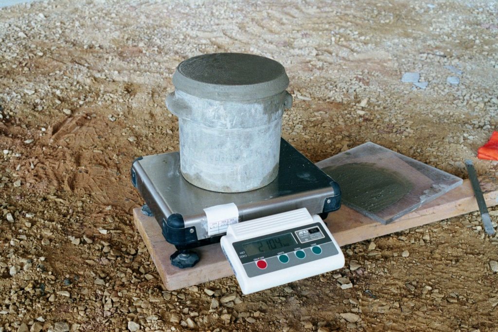 ACI 301 makes the contractor responsible for providing space for the owner’s testing agency to work.