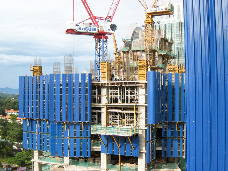 Panels of alternating corrugated steel and clear polycarbonate protect both those working in the building and those below.