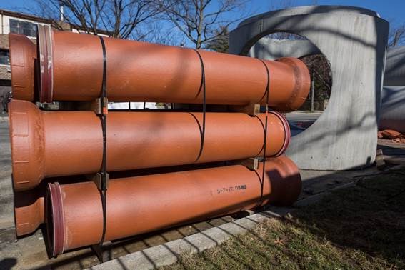 Clay pipes, chosen for durability, will be part of the neighborhood's new storm sewer system.