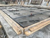 This thin panel has conventional reinforcing steel only at the perimeter and for the lifting inserts.