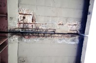 The underside of a failing bridge.