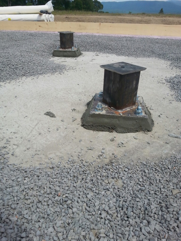 The Column Socket is positioned on the foundation prior to placement of the concrete floor slab.