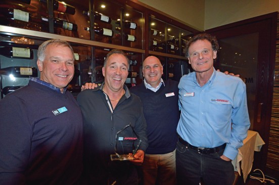 Mike Florentino received the Applicator of the Year Award for his company's year-over-year growth and achievements using the Laticrete Supercap System. From left to right: Edward Metcalf, Laticrete President and COO, Mike Florentino, former Laticrete Supercap President Doug Metchick and Laticrete Chairman and CEO David Rothberg.