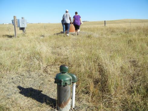 Dwain and Tanya Waldo are two of roughly 30 residents of Cedar Gulch II, a community outside Rapid City, S.D., that was to have 130 homes. When the financial crisis hit the developer sold the land on which this well head, well pit, and add-a-phase electrical panel are located to someone unaffiliated with the development. The new owner has allowed the community to continue using the well and lagoon, but operation and maintenance are residents’ responsibility. 