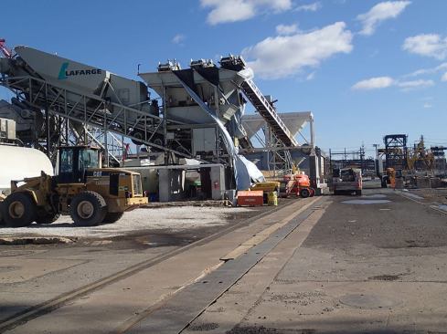 To ensure a high degree of consistency, reliability, and quality, the project team mobilized two concrete batch plants. At the fabrication site, the two portable Lafarge plants produced 72,000 cubic yards of SCC, testing every load for air content, unit weight, slump, and temperature. The specified compressive strength for the concrete on this project was 6,000 psi; however, the high-performance SCC consistently achieved strengths of 9,000 to 10,000 psi at 28 days.