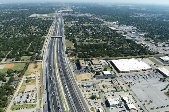 Almost 600 pivoted turnbuckle manhole risers were used to raise about 350 manholes to grade on Texas State Highway 183 from Euless to Dallas/Fort Worth.