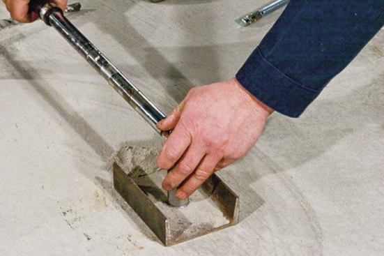 Use a torque wrench to tighten the nut as specified.