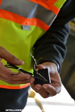 A concrete field technician activates a bluetooth concrete maturity meter.