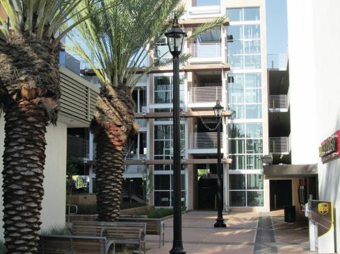 Improvements to the courtyard between the new garage and street include decorative paving, a new bus shelter, and a row of palm trees leading to the main pedestrian entrance. The four-level structure received LEED Silver certification from the U.S. Green Building council in March 2013.