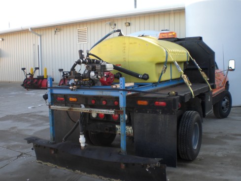 Our anti-ice unit: 325-gallon tank, engine/pump, and spray bar on a 1-ton truck.