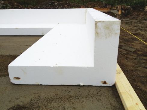 L-shaped edge forms of EPS foam are placed around the perimeter of the slab.