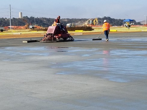 This project had variable slump and setting behavior so the finisher had to squeegee to move the excess bleed water off the slab in some areas. This crew did a great job not finishing the bleed water back into the surface.