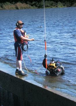 Divers locate trestle bridge piles for engineers who designed the replacement Hendrickson Dam in Punta Gorda, Fla. Photo: Stanley Consultants Inc.