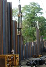 The 90-foot dam is anchored by pilings driven 40 feet deep. Once formwork was finished, concrete was piped into the forms. Photo: Merrie Carlock