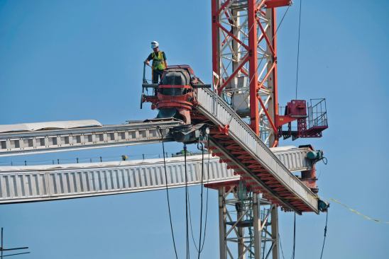 Some hard-to-reach places are served by tower-crane mounted conveyors.