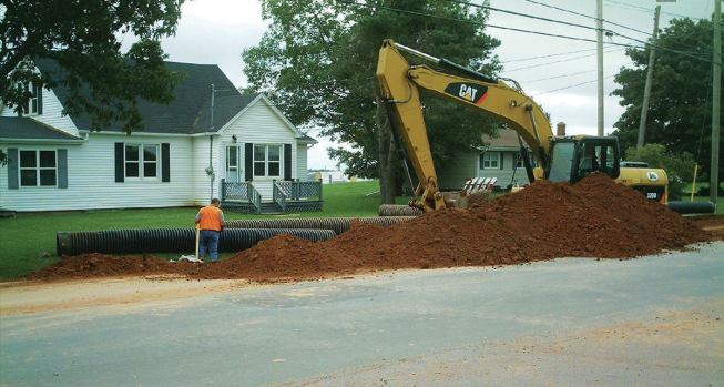According to the Plastics Pipe Institute Inc. (PPI), corrugated HDPE pipe used in a ditch enclosure is usually shallow and can experience traffic loadings if installed at road crossings. Properly installed, the pipe can withstand AASHTO HS-25 loads with a minimum of 1 foot of cover for diameters up to 48 inches and 2 feet for larger diameters. If installed under pavement in colder climates, the institute recommends 2 feet of cover or half the pipe diameter, whichever is greater.