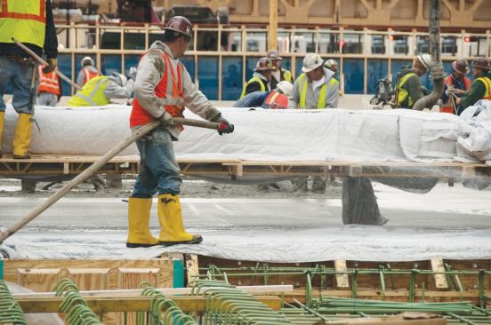 The high-performance concrete used on this project included silica fume. Slight amounts of water loss in silica-fume concrete results in cracking so curing blankets were placed and saturated shortly after the concrete was placed.