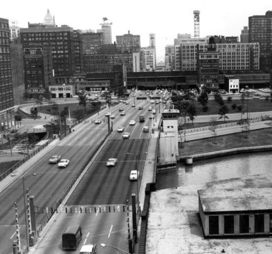 In 1909, Daniel Burnham and Edward Bennett produced a long-range plan for the development of the city of Chicago, which included the construction of Wacker Drive—a two-level street alongside the Chicago River circling two-thirds of the downtown Loop. But construction didn’t begin until 1924 on the $8 million east-west portion of the street; the north-south section wasn’t constructed until the 1950s.For the initial two-year project completed in 1926, workers installed 598 caissons to a depth of 95 feet below the surface to support the 5700-foot length of the upper deck. More than 1 million pounds of reinforcing steel, and 116,000 cubic yards of concrete were used for the columns and deck with a thickness as great as 3 feet.