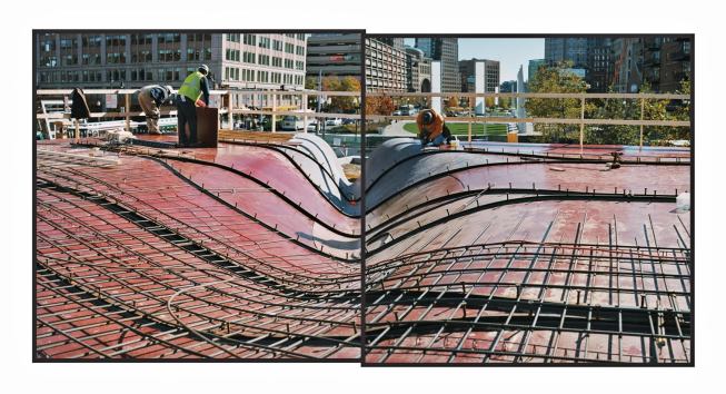 The photo shows the dramatic curving of the forming system, steel rails and Nelson studs above the beams, and steel rebar placement.