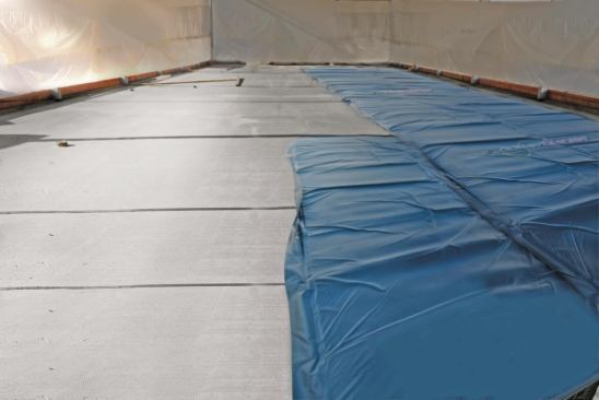 Cold weather dictated continued use of the curing blankets in order to sustain the required concrete temperatures while pouring and curing 45 concrete housekeeping pads.