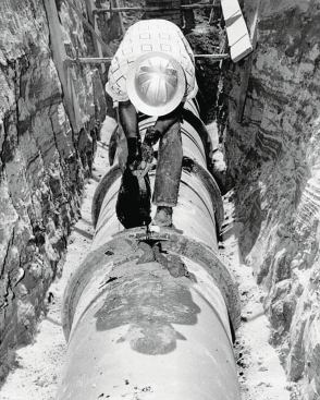 We're living with 60- to 100-year-old underground systems. Understanding how they were built leads to insightful repair and maintenance. Note the bedding and hot tar joint fill, and the worker's apparel.