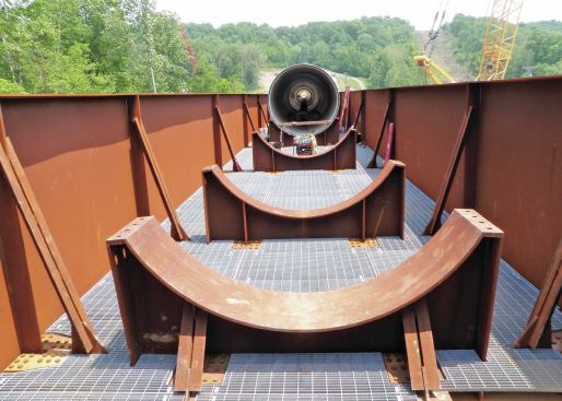 Steel cradles support 102-inch centrifugally cast, fiberglass-reinforced, polymer mortar pipe on the aerial portion of the Sanitation District No.1 of Northern Kentucky’s tunnel project. The structure is about 13 feet wide.