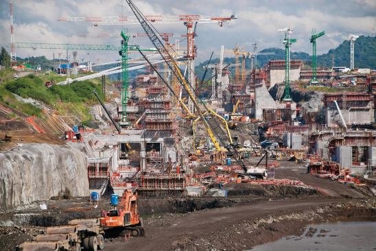 The vastness of the Panama Canal construction site, which is almost one mile long, complicates the transfer of concrete.