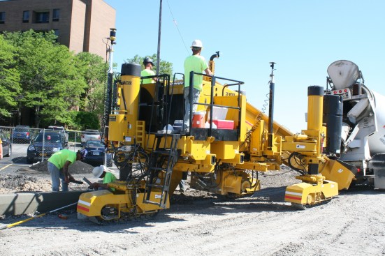 Woodstone operators are becoming familiar with the paver and stringless paving.