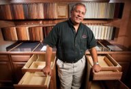 DETAILS, DETAILS: David Casey, cabinet division manager of Mobile (Ala.) Lumber & Millwork's Coast Design Kitchen & Bath showroom, uses roll-out cabinetry displays to help homeowners look beyond door styles and colors and understand differences in cabinet construction.
