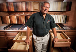 DETAILS, DETAILS: David Casey, cabinet division manager of Mobile (Ala.) Lumber & Millwork's Coast Design Kitchen & Bath showroom, uses roll-out cabinetry displays to help homeowners look beyond door styles and colors and understand differences in cabinet construction.