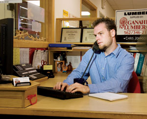 MULTITASKER: Chris Johnson, inside sales representative at Ganahl Lumber Co.'s yard in Los Alamitos, Calif., spends his day tracking current jobs, prospecting work, writing e-mails-and answering all incoming calls.