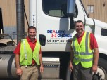Dealers Choice employees in front of a truck