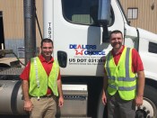 Dealers Choice employees in front of a truck