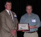 Craig Ohlmann (right) of Ohlmann Building Center, Valentine, Neb., receives Nebraska Lumber Dealer of the Year award from association chairman Bryan Jensen.