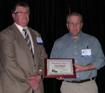 Craig Ohlmann (right) of Ohlmann Building Center, Valentine, Neb., receives Nebraska Lumber Dealer of the Year award from association chairman Bryan Jensen.