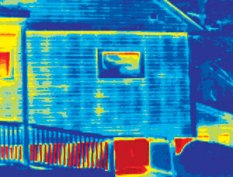 BEAT THE HEAT: Wood transmits heat to the outside much more than insulation. That difference shows up in thermal photographs like this one. Here, the studs and top plate show up as much "hotter"--yellow rather than blue--compared with the insulated spaces nearby. Energy efficiency standards going into effect soon will aim to reduce this so-called thermal bridging.