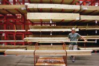 ALGONQUIN, IL - AUGUST 19: Mark Lankin loads lumber onto a cart at a Home Depot store in Algonquin, Illinois. Home Depot, the world's largest home improvement retailer, today reported higher-than-expected quarterly profit.