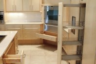 Pull-out storage shelves and easy grip handles make life easier in this universally designed kitchen.