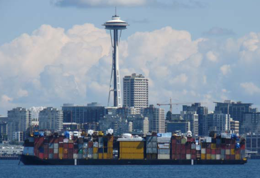 A barge leaves Seattle laden with goods Uresco was shipping to Alaska