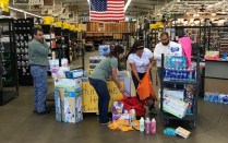 Employees of McCoy's Building Supply process donations