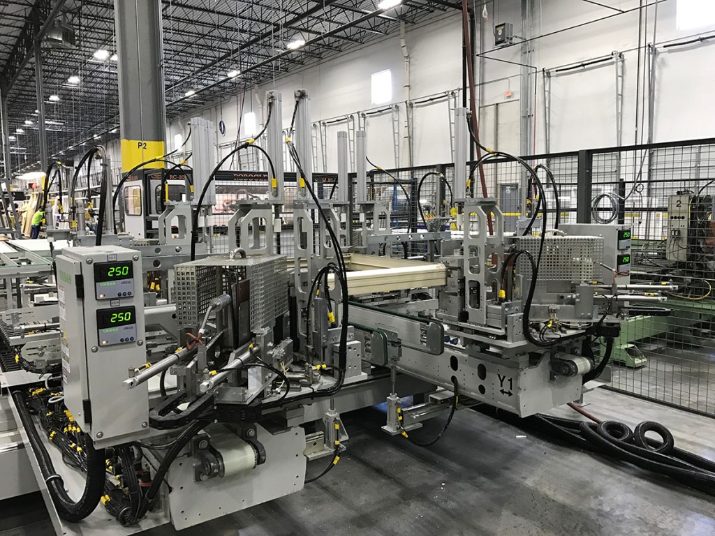 Many manufacturers, including MI Windows as shown here, are beginning to invest in robotic equipment for glass manufacturing lines in order to reduce human error.