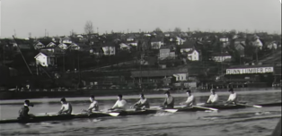 The University of Washington rowing crew, gold-medal winners in the 1936 Olympic Games, practice on Seattle's Lake Union near Dunn Lumber's yard. Dunn has produced a new documentary about that team.