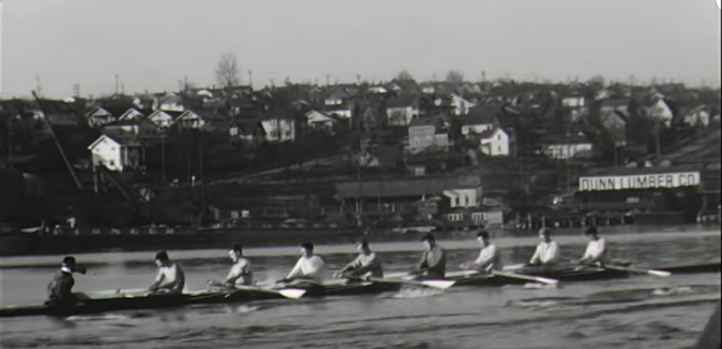 The University of Washington rowing crew, gold-medal winners in the 1936 Olympic Games, practice on Seattle's Lake Union near Dunn Lumber's yard. Dunn has produced a new documentary about that team.