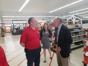 Tom Leavitt of Marcus (Iowa) Lumber chats with Sen. Chuck Grassley, R-Iowa, during the senator's visit to Marcus on May 30, 2018. In the background is legislative aide Jennifer Heins